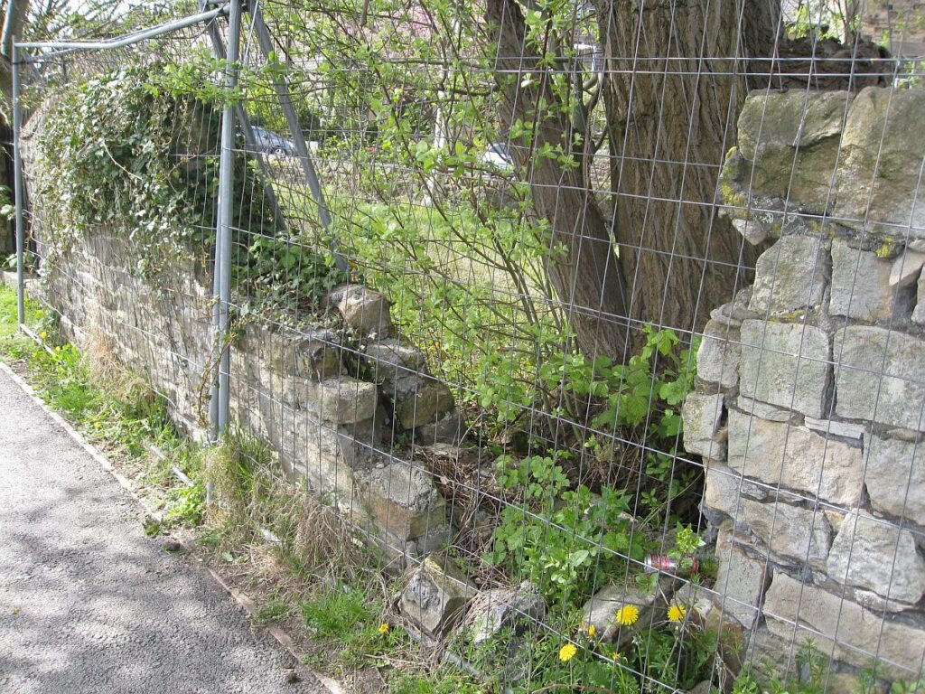 Part of the wall has collapsed on the towpath