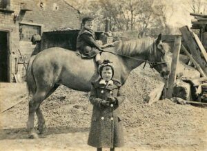 Annie and a cousin, at Joe’s yard in 1905 with one of Joe’s ponies