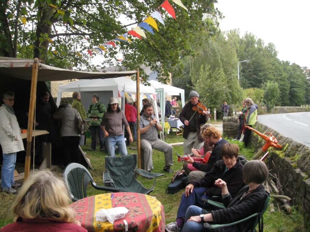 People sitting while musicians play