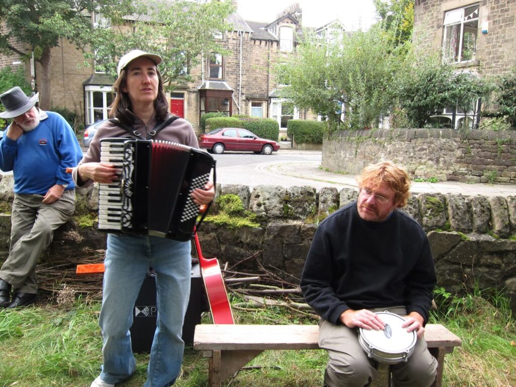 An accordian player at the cake sale