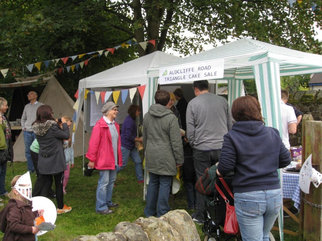 People queuing at the cakes and tea stalls