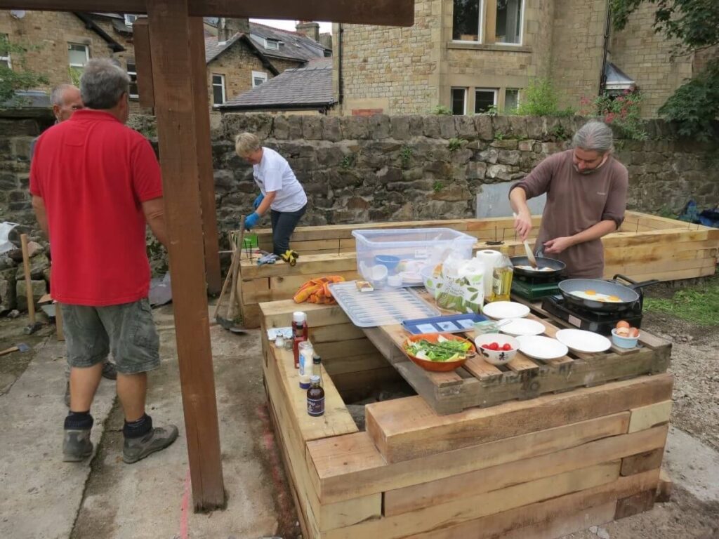 Food being prepared on a platform on top of one of the beds