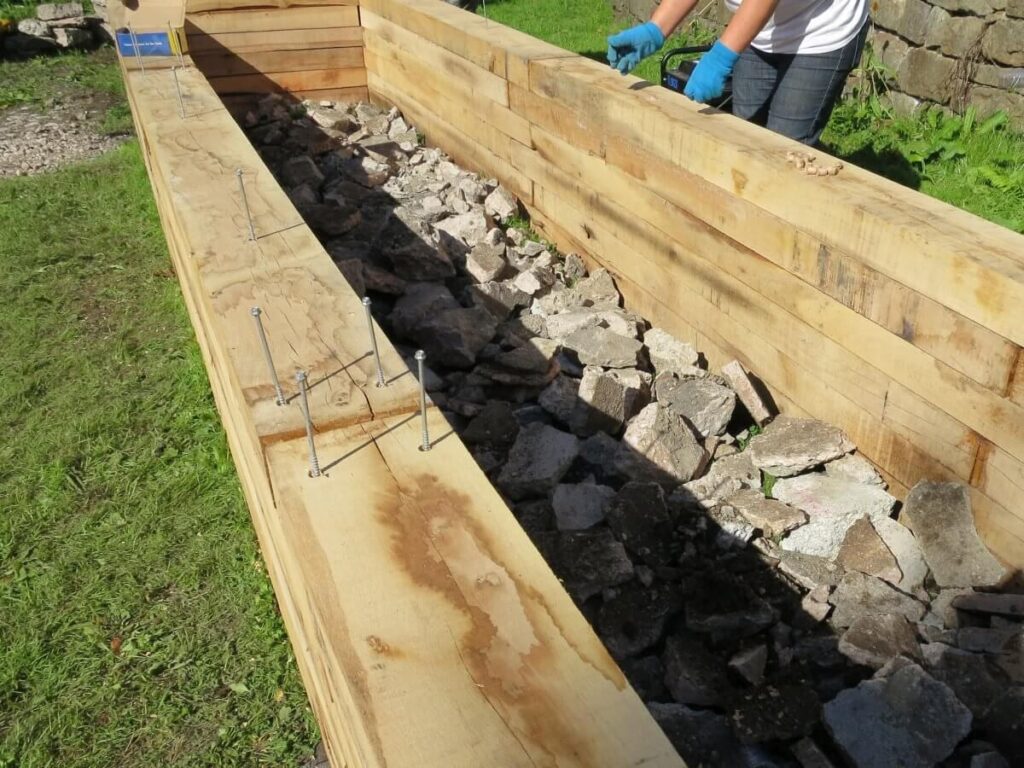 Stones at the bottom of the bed for drainage