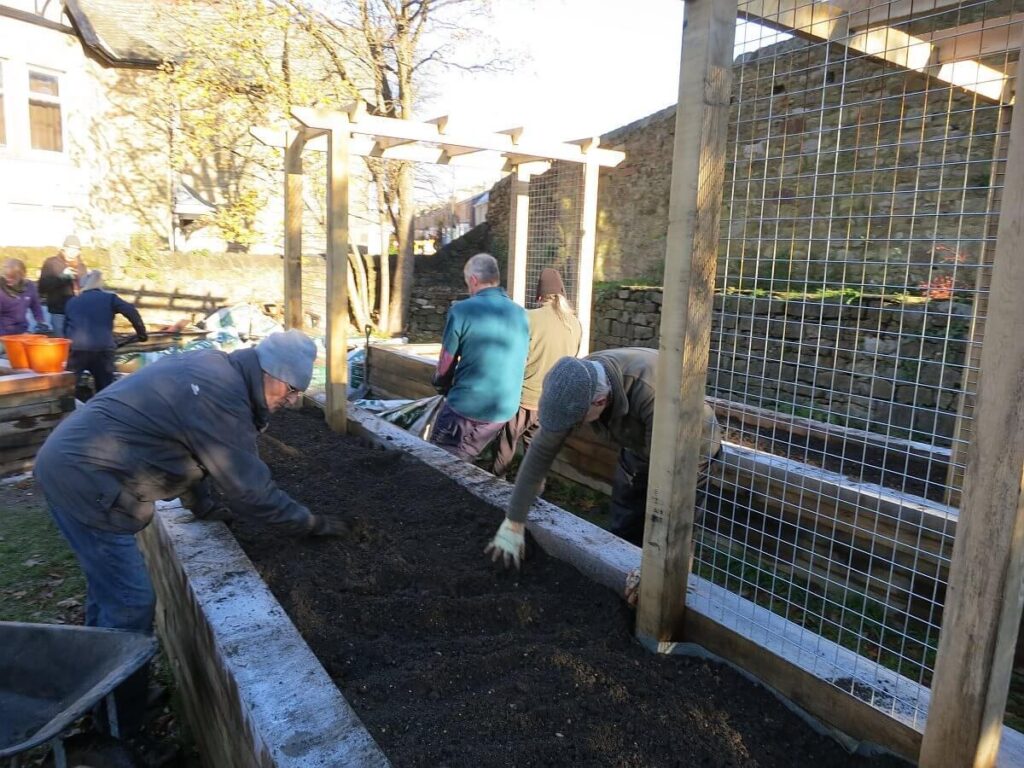 Constructing the raised beds at the Triangle