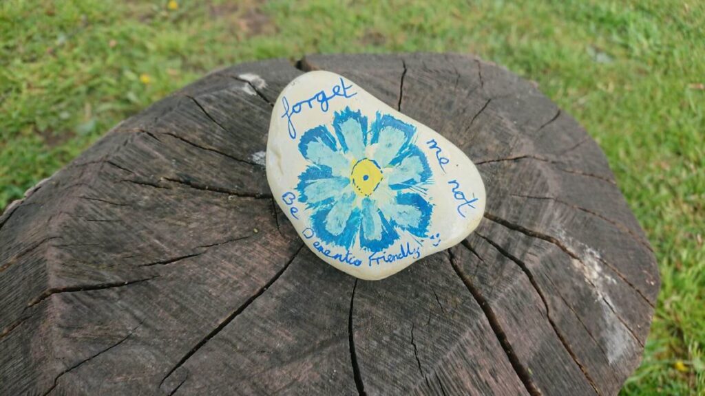 One of the painted stones left on the Triangle over the last year