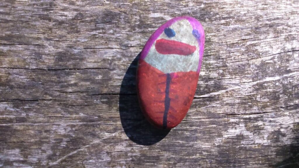 One of the painted stones left on the Triangle over the last year