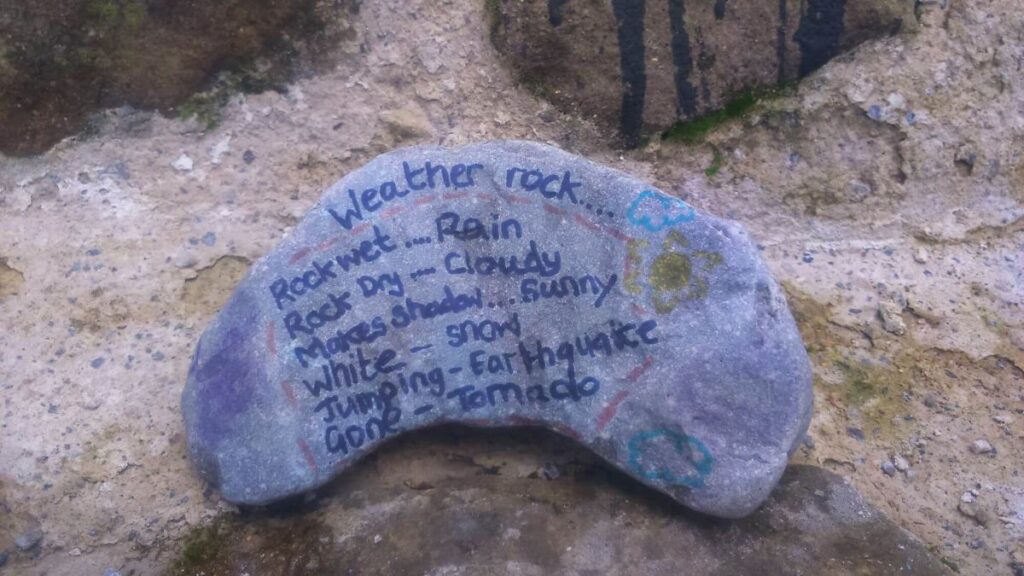 One of the painted stones left on the Triangle over the last year