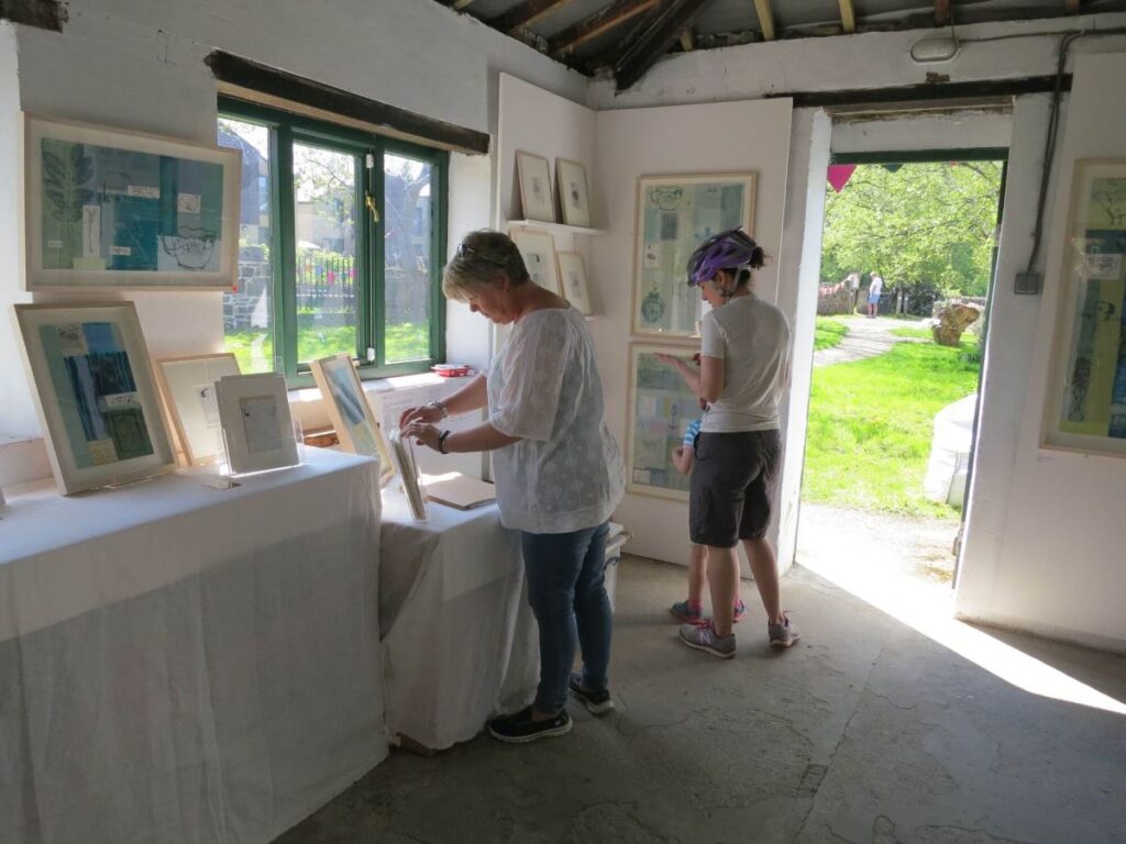 People viewing the art exhibition at the Triangle