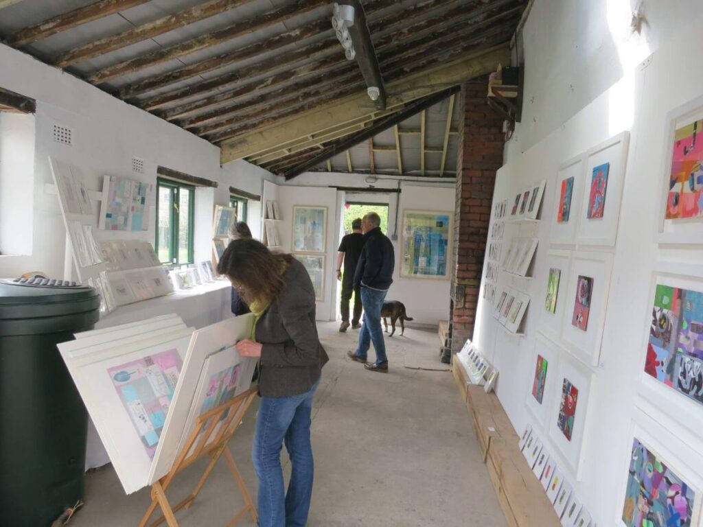 People viewing the art exhibition at the Triangle