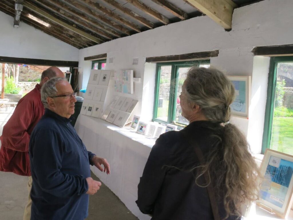 People viewing the art exhibition at the Triangle