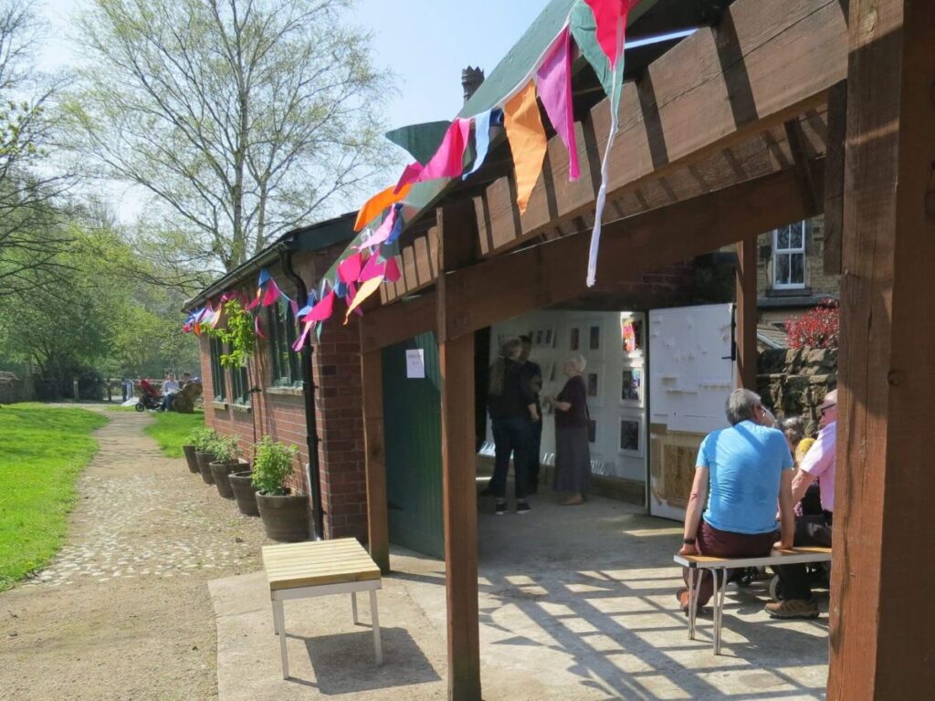 People viewing the art exhibition at the Triangle