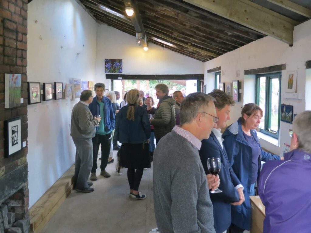 People attending the art exhibition at the Triangle