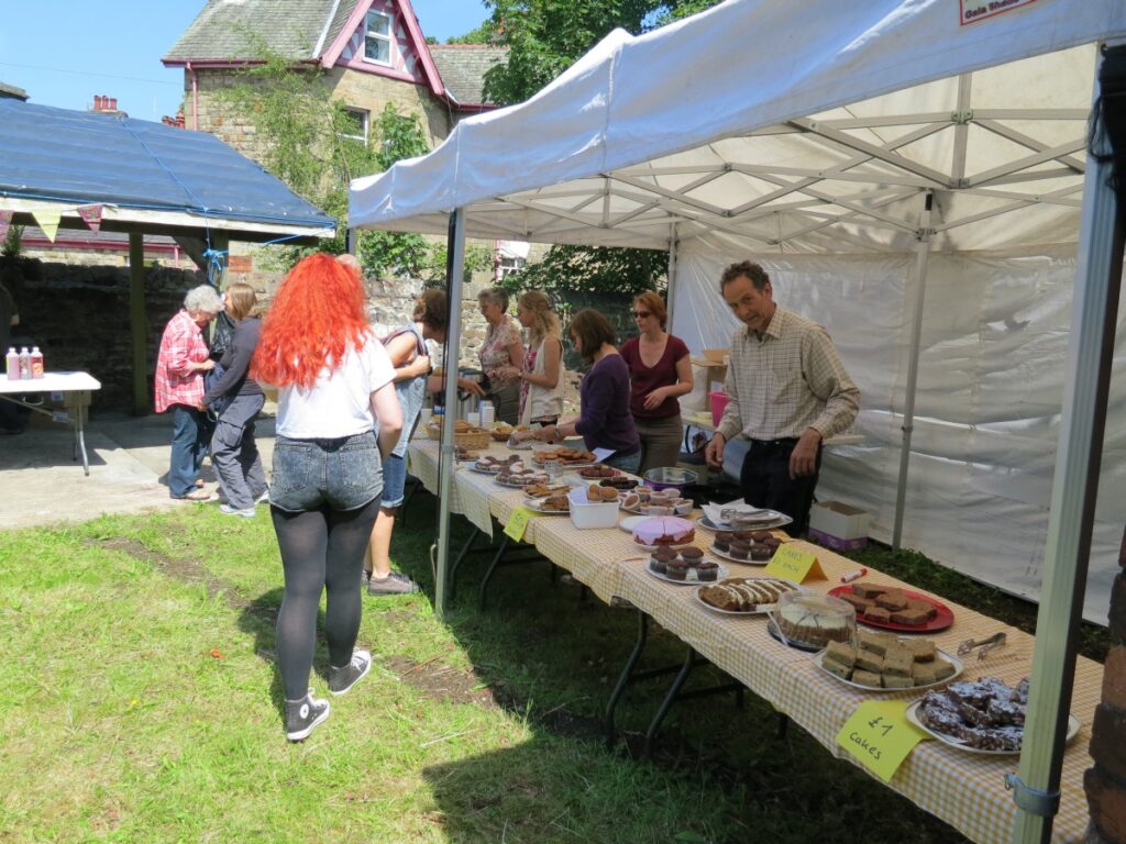 People attending the summer fair at the Triangle