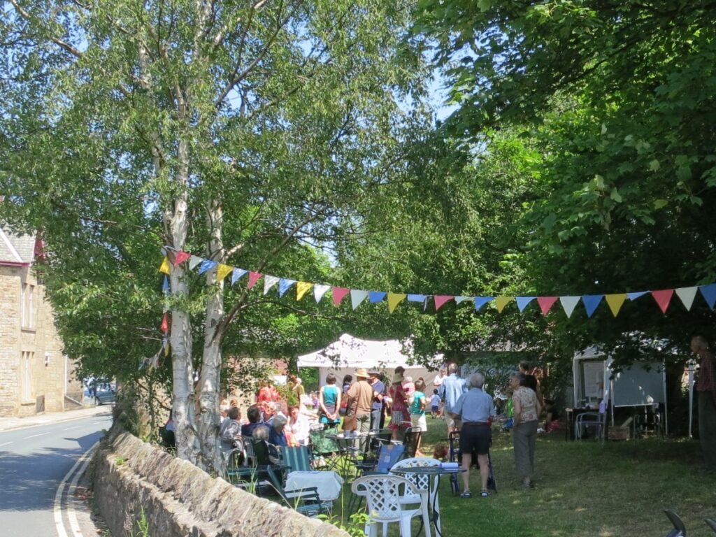 People attending the summer fair at the Triangle