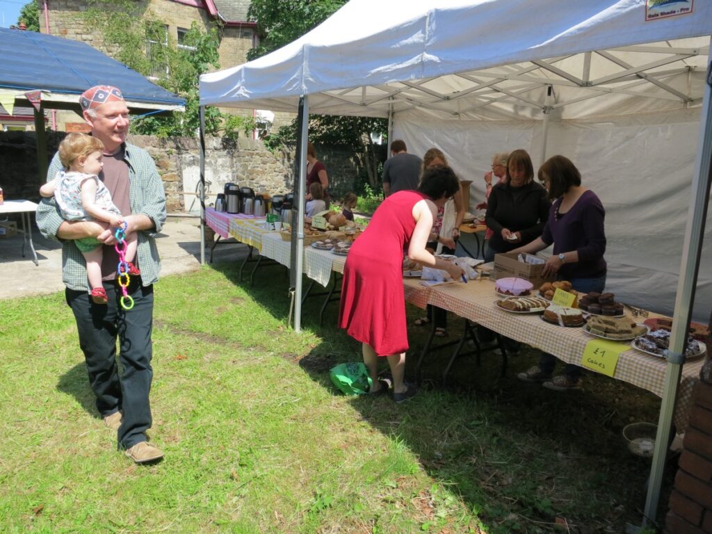 People attending the summer fair at the Triangle