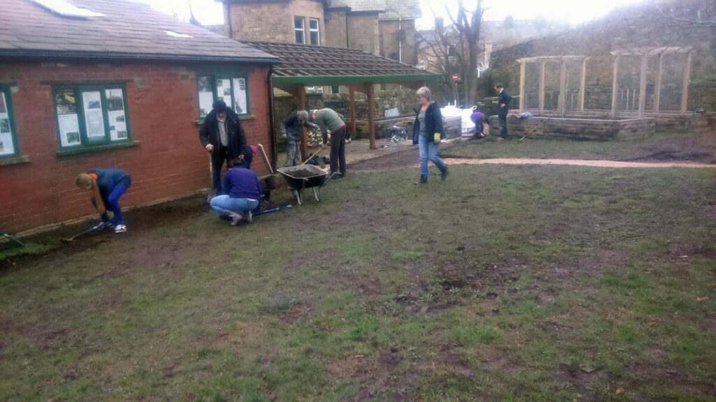 Working on the paths, ground and raised beds