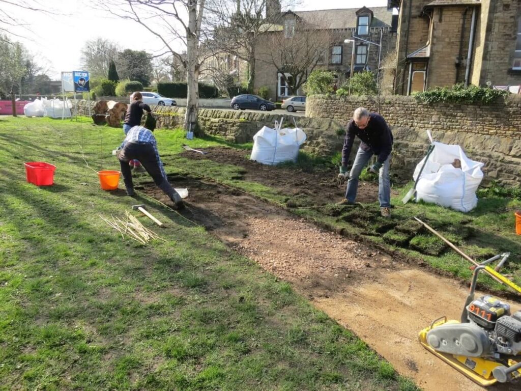 Working on the paths, ground and raised beds