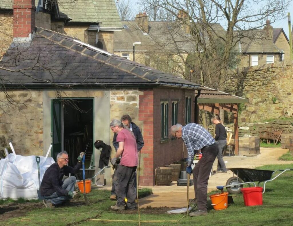 Working on the paths, ground and raised beds