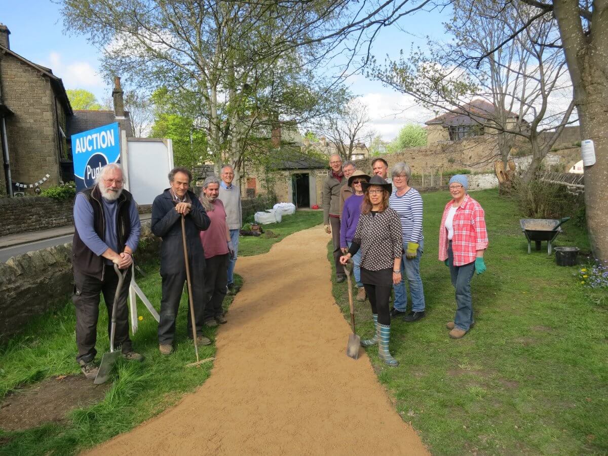 Working on the paths, ground and raised beds