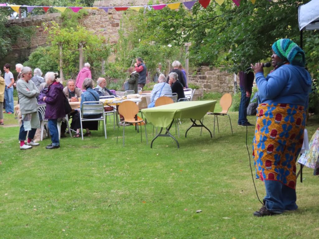 Maz performing with people watching -Triangle Summer Fair August 2025